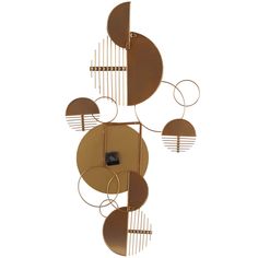 a metal sculpture with circles and bars on the sides, against a white wall background