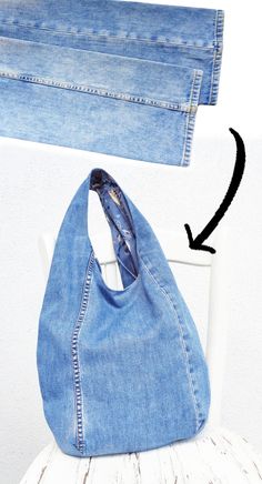 a pair of jeans sitting on top of a white chair next to a blue purse