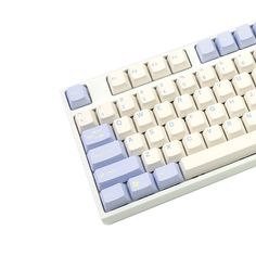 a white and blue computer keyboard on a white surface with the keys highlighted in yellow