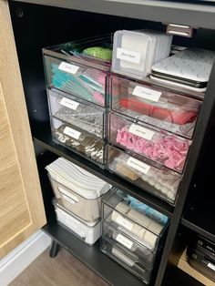 the drawers are organized with clear plastic containers