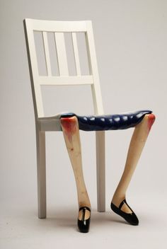 a wooden chair that has been painted white and blue