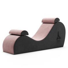 a black and pink lounge chair sitting on top of a white floor