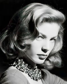 black and white photograph of a woman wearing a necklace