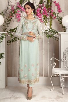 Add style to your wardrobe with this mint no., over a canvas of embroidered chiffon featuring floral embroidery in dabka, naqshi, pearls and beads. Hand crafted tassel and loop button details on side hem for additional style quotient. This stunning shirt is paired with straight pant and sequin embellished dupatta with 3d floral details to complete the look. Shirt Fabric: Pure Embroidered ChiffonShirt Length: 48”Pant Fabric: Pure Raw SilkDupatta Fabric: Pure ChiffonShirt ,Pant & Dupatta Color Elegant Pista Green Kurta With Floral Embroidery, Eid Embellished Pista Green Kurta, Embellished Pista Green Kurta For Wedding, Pista Green Embellished Kurta For Wedding, Embellished Pista Green Salwar Kameez For Eid, Spring Reception Sets With Dabka Work, Designer Embellished Kurta For Spring, Spring Designer Embellished Kurta, Embellished Pista Green Georgette Dress