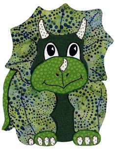 a green and black animal with spots on it's face, sitting in front of a