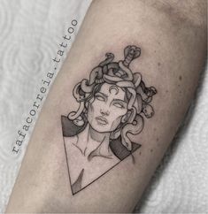 a woman's head with snakes in her hair tattoo on the left forearm and upper arm