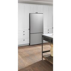 a stainless steel refrigerator in a white kitchen