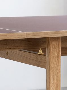 a ping pong table with two pieces of wood on it and one piece missing