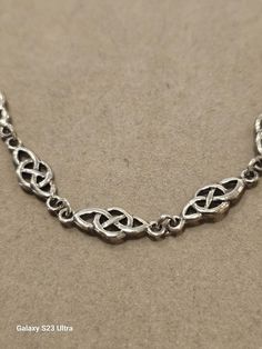 Wonderful Celtic Knot style Necklace.Sterling Silver marked on the back and on the clasp. It measures 18 inches with a bit extra. One of the classic but simpler celtic knots.Can be worn with your jeans or on an evening out ti someplace fancy.This will become one of your go to peices of jewlery. Very good condition,appears to have been worn very little. Celtic Knots, Style Necklace, Necklace Sterling Silver, Celtic Knot, Link Necklace, Vintage Sterling Silver, Pendant Necklaces, Necklace Etsy, Jewelry Necklace Pendant