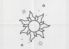 a drawing of a sun on a white paper