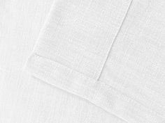 closeup of the white linens on an unbuttoned shirt