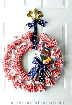 a patriotic wreath hanging on the front door