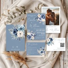 wedding stationery with blue flowers and greenery