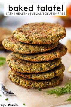 a stack of baked falafel on top of a cutting board