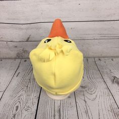 "Baby and Kids Duck Fleece Hat This is a duck hat made from yellow and orange fleece. It features stuffed fleece beak and felt eyes. Hat Sizes: Baby: Approx. 20\" around Child: Approx. 22\" around Youth: Approx. 23 1/2\" around Hat shown is a child size on a 18 1/2\" (47cm) head. Care: Machine wash on cool or warm; dry on low. Turnaround time is 1-3 business days. Standard Shipping is usps first class (3-5 business days). Upgrade to priority (2-3 day) and priority express (1-2 day) is available. Orange Fleece, Trapper Hats, Fleece Hat, Baby Ducks, Animal Hats, Winter Animals, Easter Chicks, Hat Sizes, Hat Making