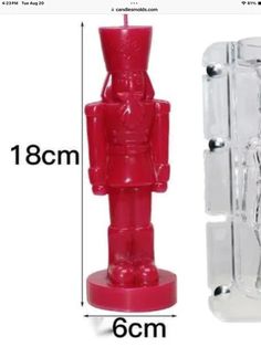 an image of a red plastic toy figure