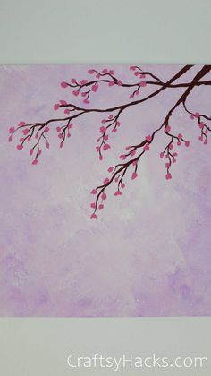 a painting of a tree branch with pink flowers on purple and white background that says crafty hacks