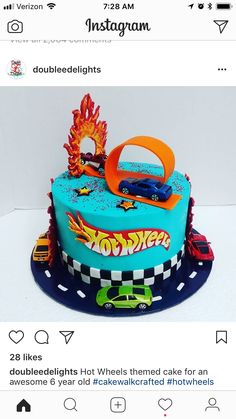 a birthday cake with hot wheels on top and an orange ring in the middle that says,