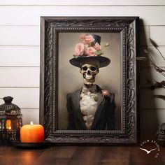 a framed photograph of a skeleton wearing a top hat and holding a rose in its left hand