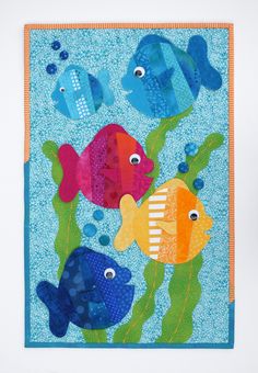 an image of colorful fish in the sea with bubbles and bubbles on blue watercolor paper