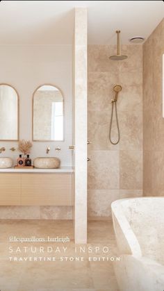 a bathroom with two sinks and a bathtub next to each other in the same room