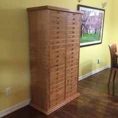 a large wooden cabinet sitting in the corner of a room