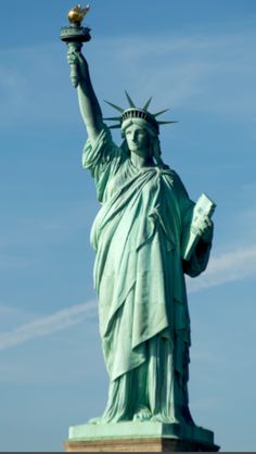 the statue of liberty is shown with its torch in it's left hand,