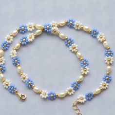 Beaded flower necklace for women. In two lovely tones of blue or simply blue and white colors. Highlighted with high luster freshwater pearls. Perfect for everyday use perfect as a gift.