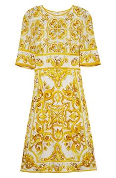 A print inspired by hand-painted majolica tiles covers this stretch silk dress. 41 1/2" length (size 44 IT) Back zip closure Jewel neck Short sleeves 94% silk, 6% spandex Dry clean Made in Italy Women's Designer Clothing Luxury Baroque Print Dress, Luxury Yellow Silk Dresses, Elegant Silk Dress With Baroque Print, Majolica Tiles, Silk Charmeuse Dress, Charmeuse Dress, Tile Covers, Dolce Gabbana Dress, Silk Charmeuse