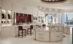 the interior of a jewelry store with chandelier and counter tops in white marble