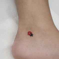 small ladybug tattoo on the ankle