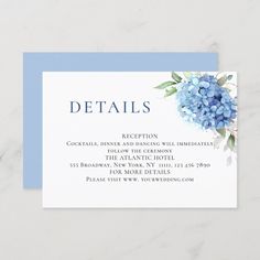 a blue hydrangea wedding details card on a marble surface with the words details written below it