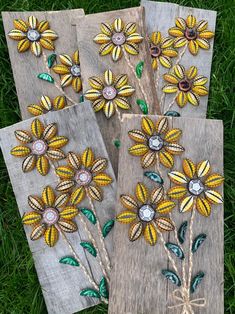 three wooden boards with flowers painted on them