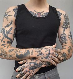 a woman with tattoos on her arms and hands