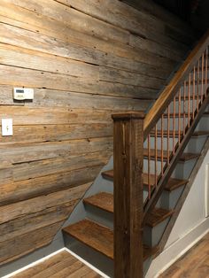 the stairs are made from wood and have metal handrails on each side, along with an electrical outlet