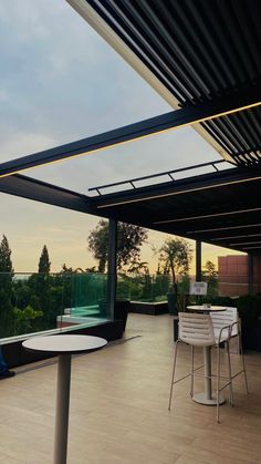 an outdoor dining area with tables and chairs