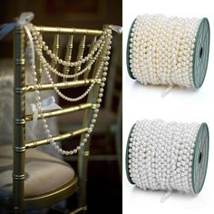 two rolls of white pearls sitting next to each other on top of a gold chair