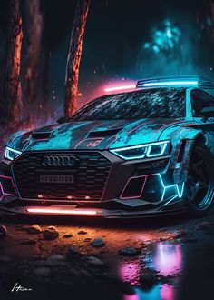 an audi car is shown in the dark with neon lights on it's hood