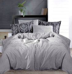 the comforter is made up with black and white striped sheets