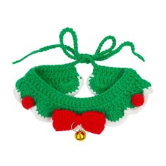 a crocheted christmas decoration with bells on the end and a bell attached to it