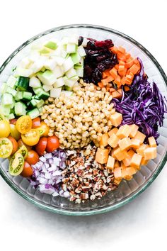 a glass bowl filled with different types of vegetables