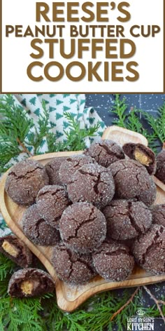 a wooden platter filled with cookies covered in powdered sugar