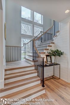 a staircase in a home with wood floors and white walls