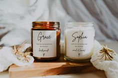 two candles sitting next to each other on a table