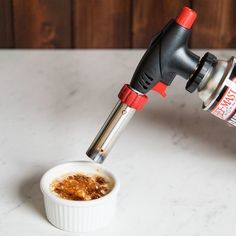 Crystalize caramel and sugar to create mouthwatering creme brulee, meringue pies, sugar designs, and more with this premium butane cooking torch at your restaurant or bakery! Not only does this compact torch help you create your most popular and decadent sweets, but it can also crisp meats, skin tomatoes, put the finishing touches on ice sculptures, or melt cheese on gratins.   This butane torch provides 4873 BTU with a high-performance adjustable flame that heats up to 2192 degrees Fahrenheit t Restaurant Utensils, Meringue Pies, Cooking London Broil, Cooking With Ground Beef, Cooking Light Magazine