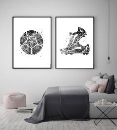 two black and white prints on the wall above a bed