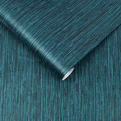 a blue and green wallpaper with vertical stripes on the fabric, which is very thin