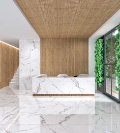 a white marble counter top sitting under a wooden ceiling