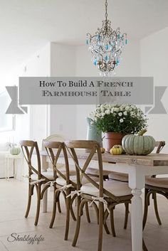 a dining room table with chairs and a chandelier