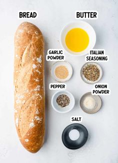 the ingredients to make bread on a white surface